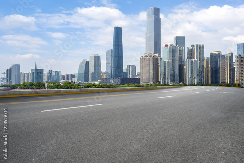 Road pavement and Guangzhou city buildings skyline © 昊 周