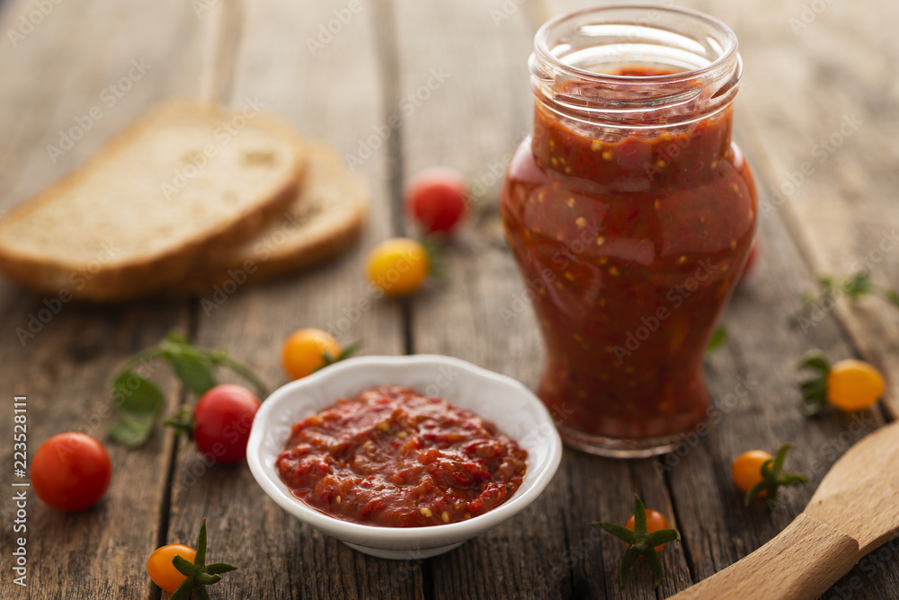 Homemade made lutenica in glass jar on the table Homemade made lutenica in glass jar on the table