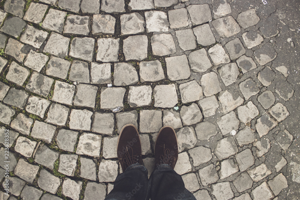 POV shot of a man in brown shoes standing on the pavement Stock Photo |  Adobe Stock