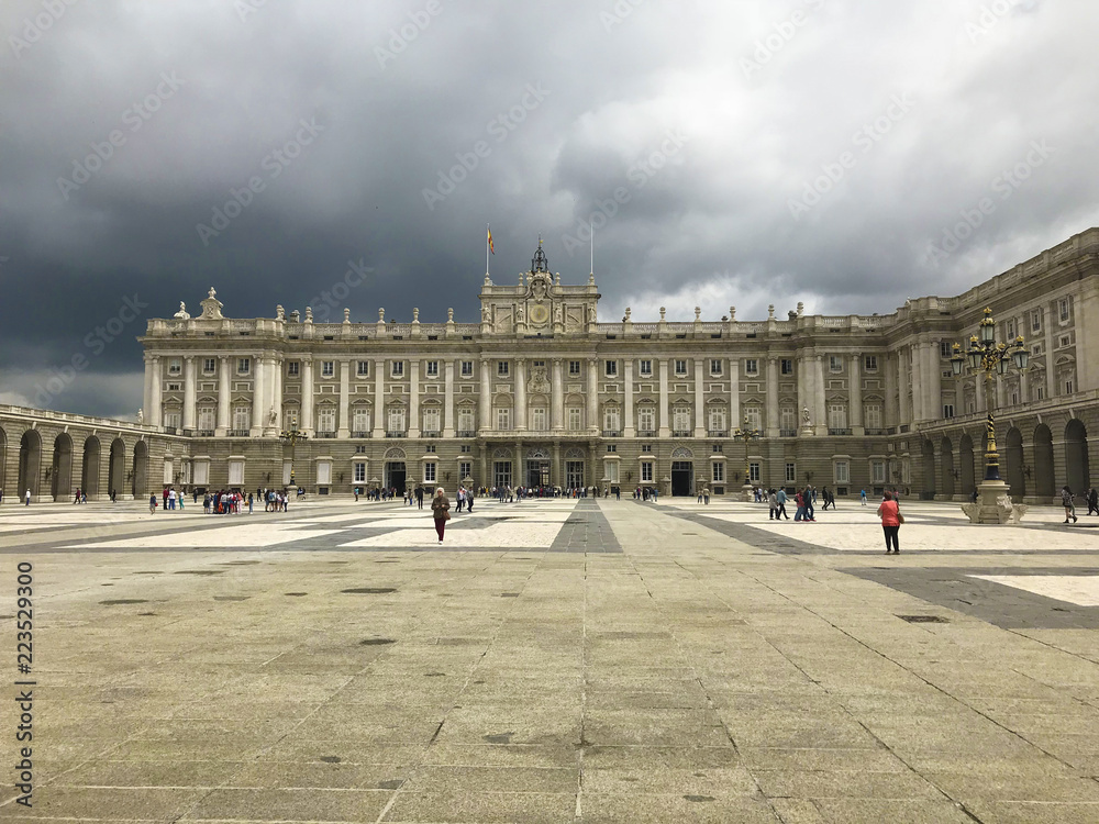Tourists walking in the courtyard of the royal palace of Madrid. Spain.
