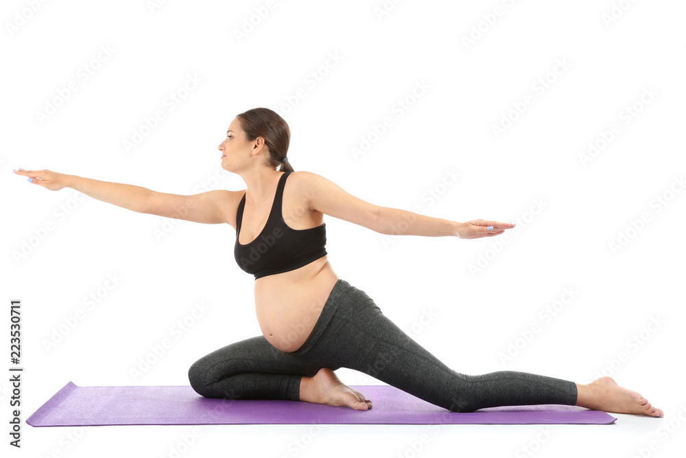 Young pregnant woman practicing yoga on white background Young pregnant woman practicing yoga on white background