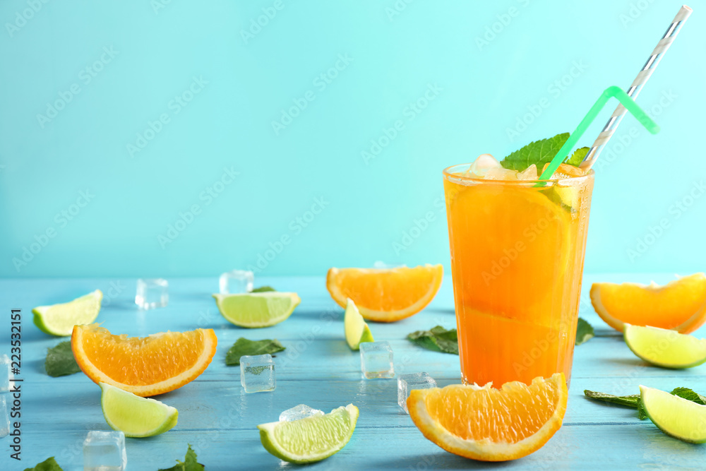 Fresh summer cocktail in glass on color wooden table Fresh summer cocktail in glass on color wooden table