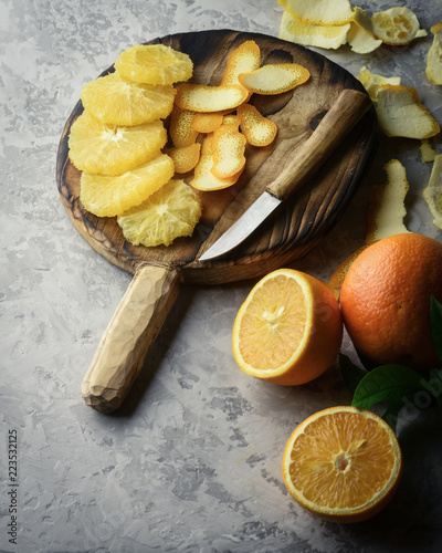 Orange pieces on grey plate closeup. Healthy diet vitamin concept. Food photography