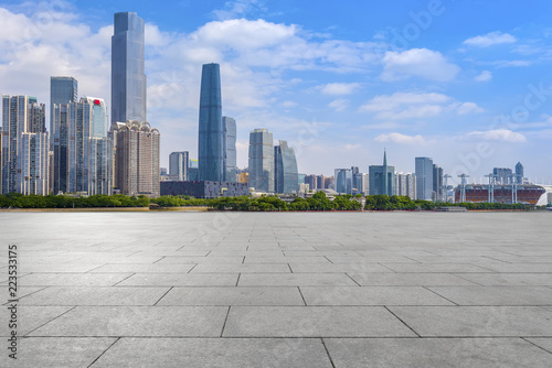 Urban skyscrapers with empty square floor tiles © 昊 周