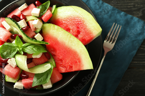 Plate with delicious watermelon salad on table  closeup