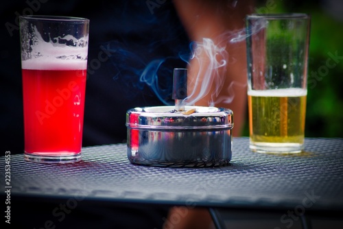 Smokes and drinks