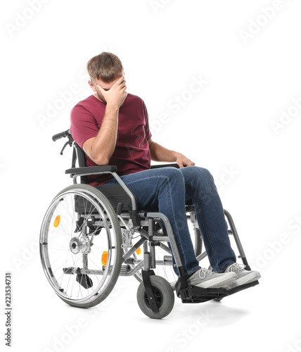 Depressed young man in whee...