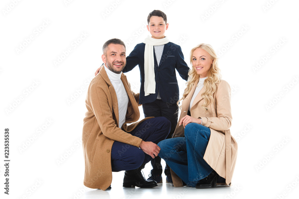 happy family hugging with son in autumn outfit, isolated on white happy family hugging with son in autumn outfit, isolated on white