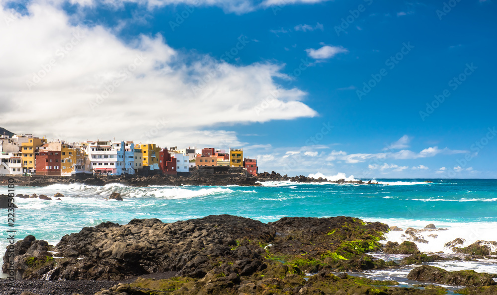 View of colourful houses of Punta Brava from beach Jardin in Puerto de la Cruz, Tenerife, Canary Islands, Spain