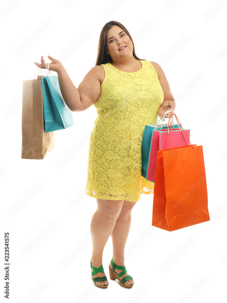 Overweight woman with shopping bags on white background