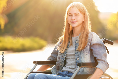 Cute teenage girl in wheelc...