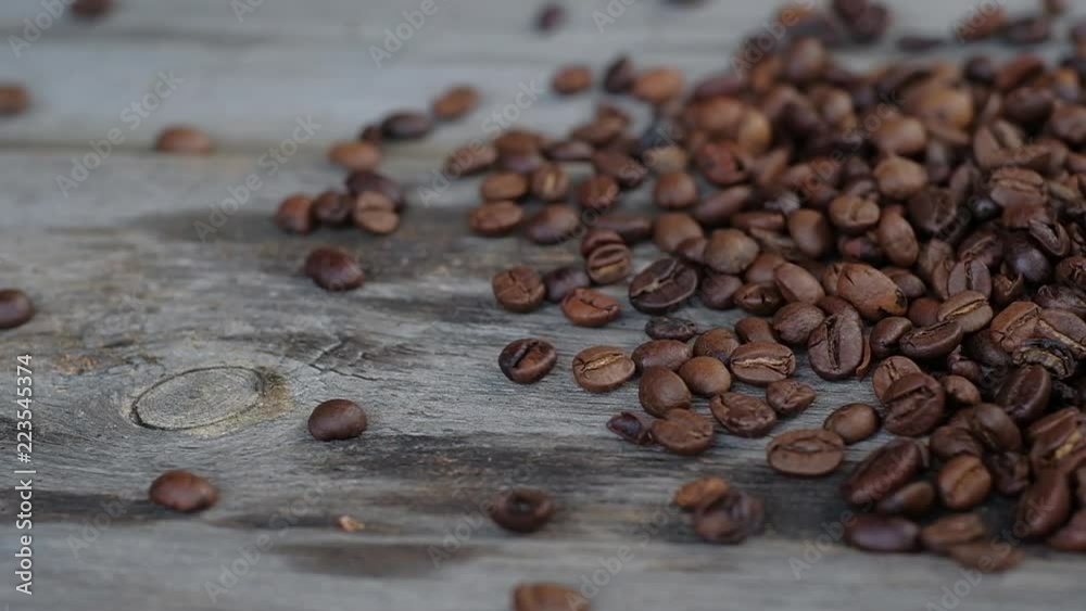 coffee beans pour on wooden boards coffee beans pour on wooden boards