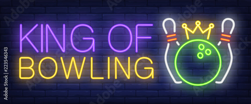 King of bowling neon text, skittles and ball with crown. Bowling club and advertisement design. Night bright neon sign, colorful billboard, light banner. Vector illustration in neon style.