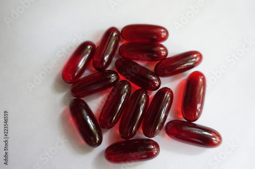 Transparent red softgel capsules of krill oil photo