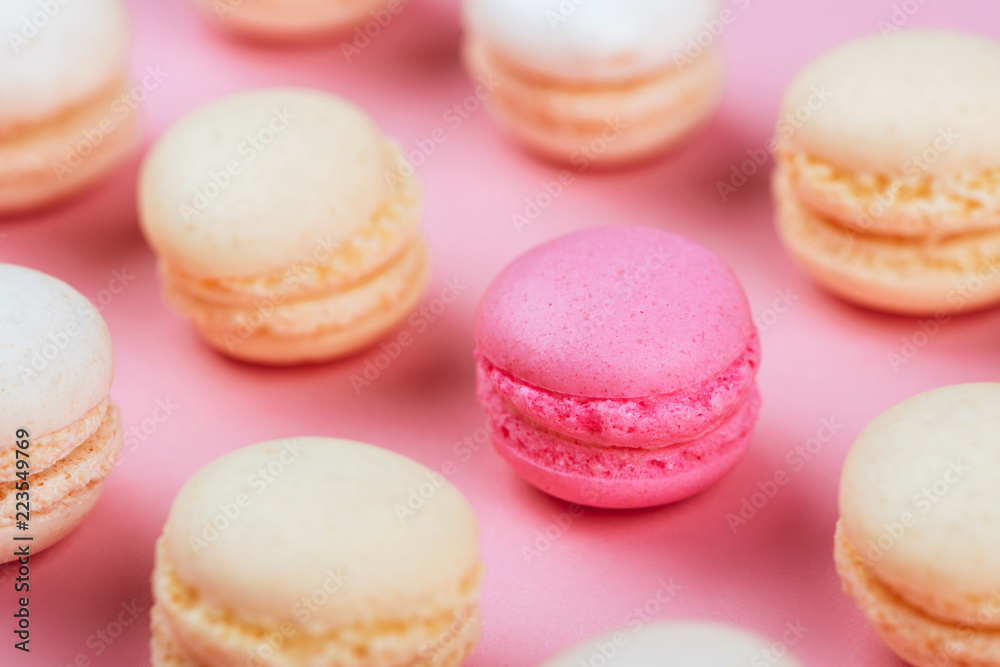 Macaroons in a pink background.