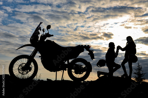 motorcyclist's marriage proposal and happiness concept © emerald_media