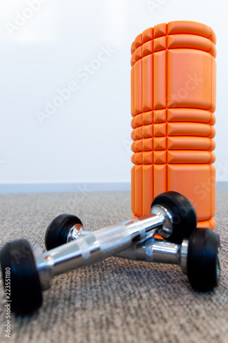 Foam roll and dumbbells photo