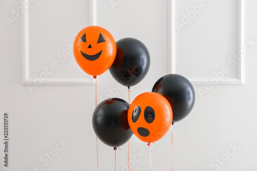 Color balloons for Halloween party on light background © Pixel-Shot