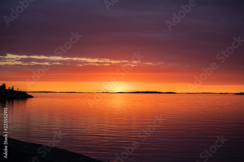 The setting sun on the Island of Asp   in Archipelago National Park  Sk  rg  rdshavet nationalpark   Finland  4 days after the summer solstice.