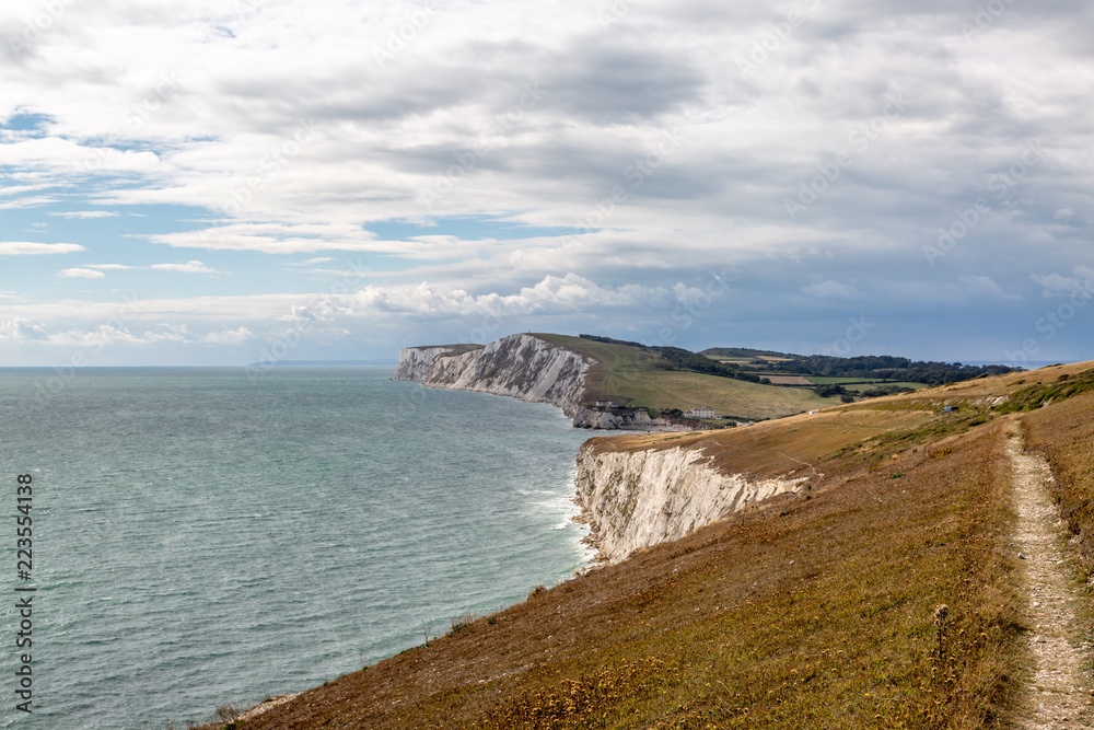 Looking along a coastal path on the Isle of Wight, towards Tennyson Down and Freshwater Bay