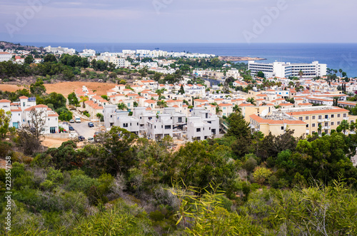 Scenic landscape of houses on the background of a calm blue sea horizon