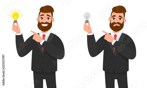 Happy businessman holding bright bulb and pointing to it. Unhappy businessman holding bulb and pointing and standing against isolated white background.  Innovation and idea concept illustration.