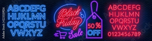 Black Friday neon lettering on brick wall background with the alphabet photo