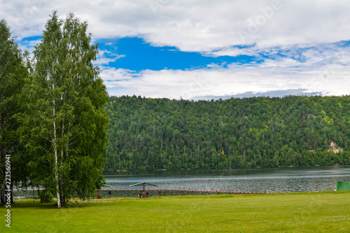river in the forest and sky on the horizon