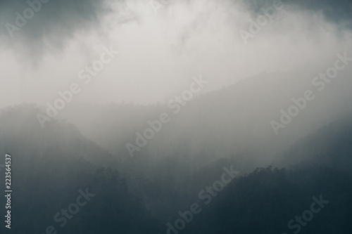 Fotografie, Obraz Landscape image of greenery rainforest hills on rainy day with cloudy sky backgr