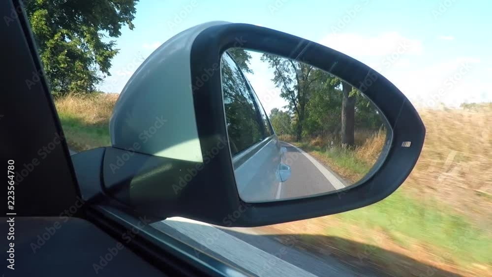 car rear view mirror on the right in motion car rear view mirror on the right in motion