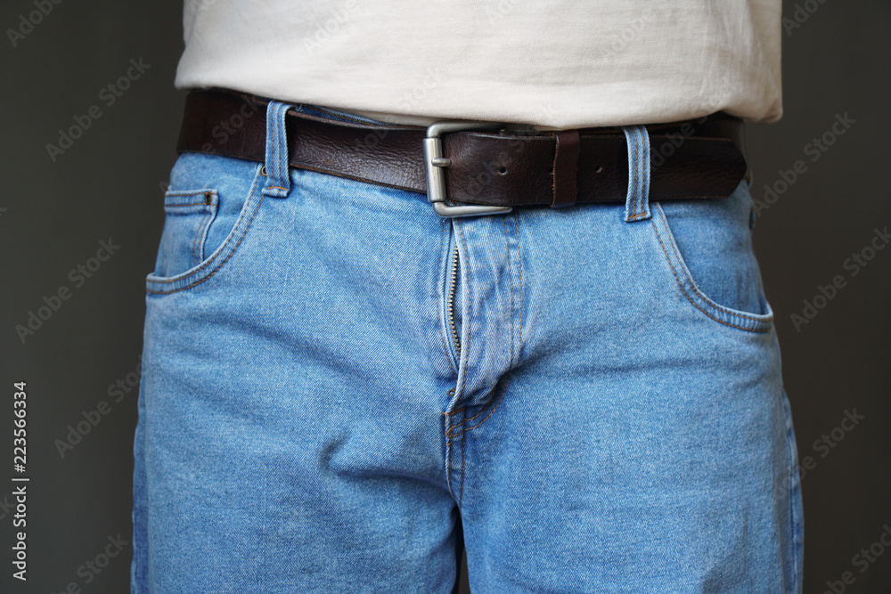 midsection of unrecognizable man dressed in jeans with open fly or flies or  zipper Stock Photo