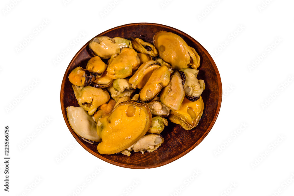 Ceramic plate with prepared mussels isolated on a white background Ceramic plate with prepared mussels isolated on a white background