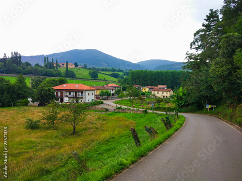 Rural road to a small village in middle of the field. Paladin, Asturias, Spain. Camino de Santiago Primitivo