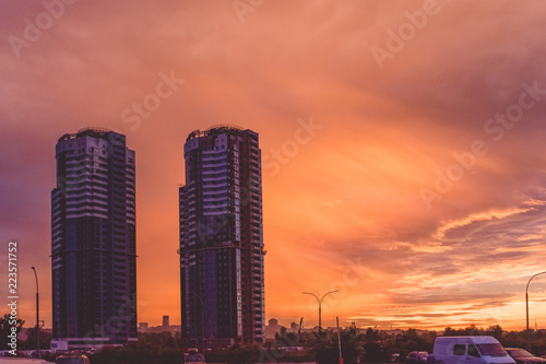  Beautiful sunset. Sunset over the city. Skyscrapers. Multicolored sky. Clouds.