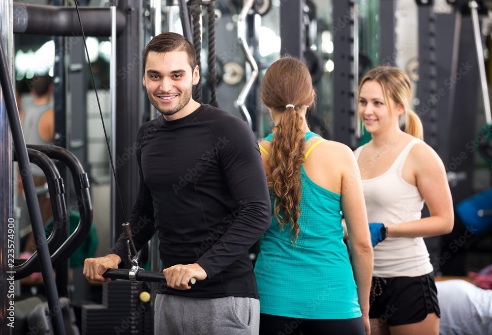 Fototapeta premium Active people having weightlifting training