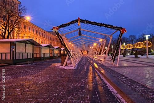 Christmas market in the early morning. Favorite place for rest and entertainment for locals and tourists. Empty street with closed kiosks for souvenirs and open-air cafes. Winter, Kyiv, Ukraine