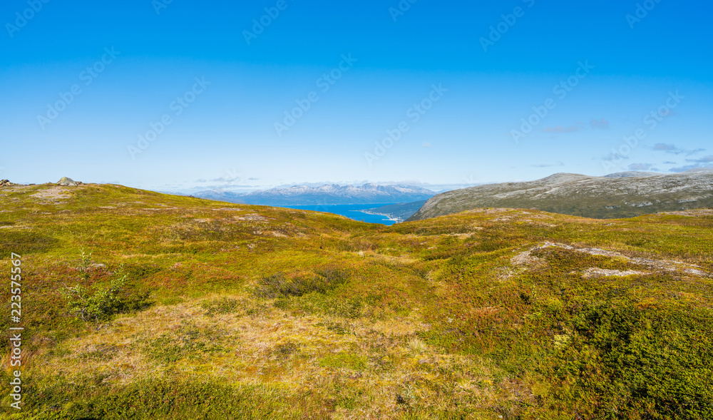 Aerial view of the mountains and hills around Tromso and Tromsoysundet strait in Norway