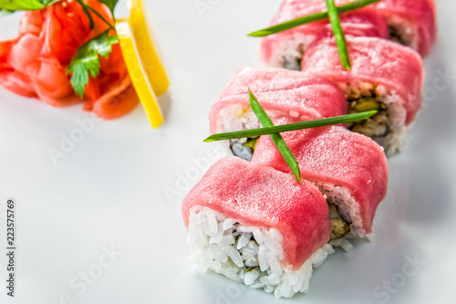 Various kinds of sushi served on black stone