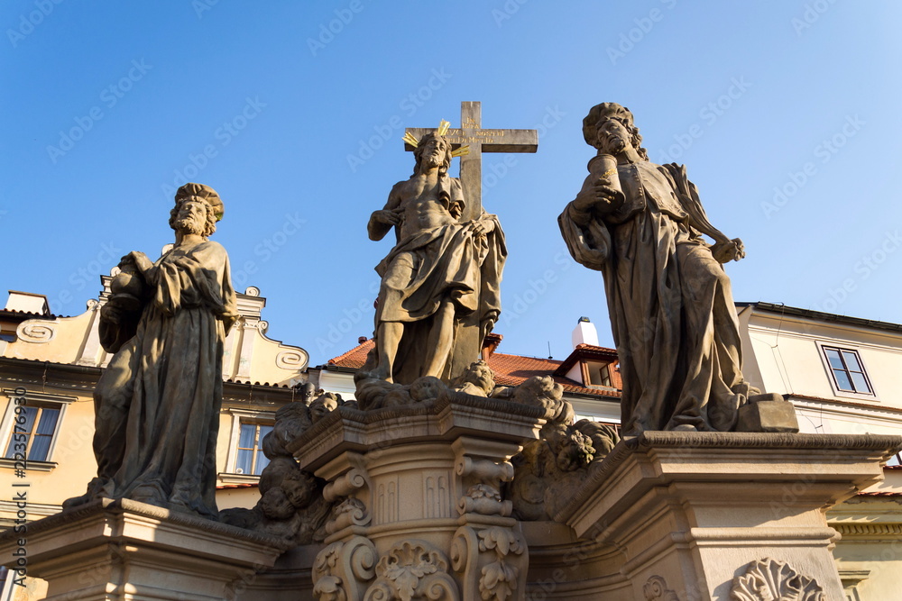 Statue of Holy Savior with Saints Cosmas and Damian detail on Charles Bridge, Prague, Czech Republic