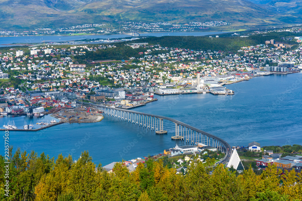 View of Tromso on island of Tromsoya linked across Tromsoysundet strait with Tromsdalen on mainland by a Tromso Bridge. Norway