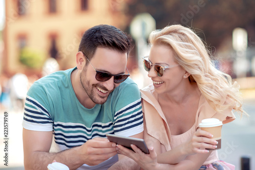 Young couple with digital tablet