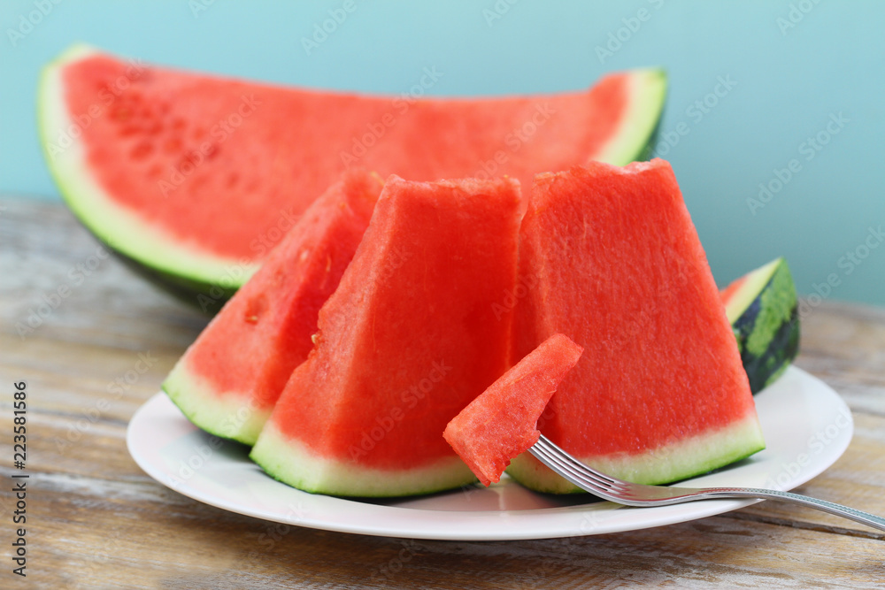 Slices of juicy water melon on plate, closeup
Slices of juicy water melon on plate, closeup