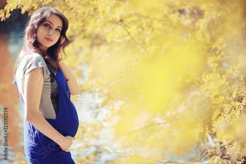 Pregnant woman on a walk in the park