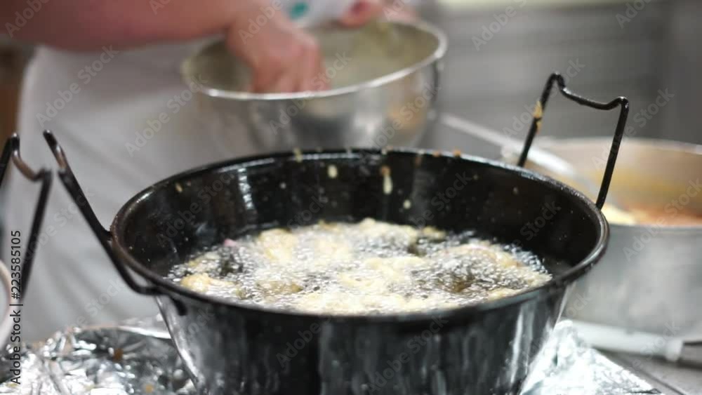 Frying rings of squid in deep oil Frying rings of squid in deep oil