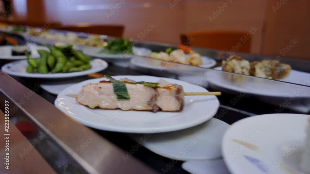 Dish of Raw Food on conveyor belt Dish of Raw Food on conveyor belt