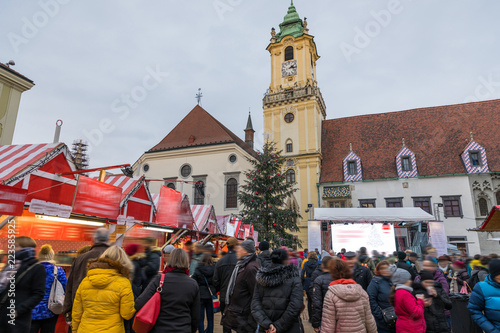 View on Christmas market on the Main square in Bratislava,Slovakia. Stara radnica and Bratislava Christmas Market, blurred people can be seen. photo