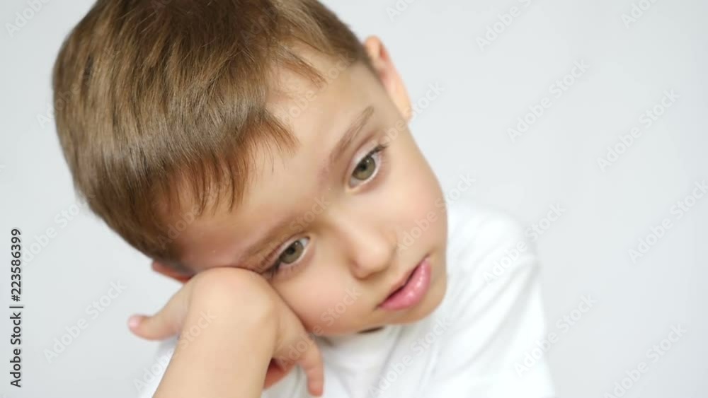 Portrait of a thoughtful child who leaned on his arm. Portrait of a thoughtful child who leaned on his arm.