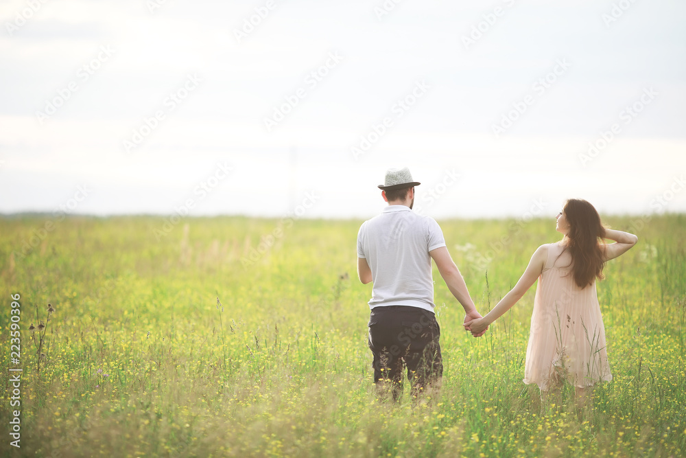 Couple man and pregnant girl in the field Couple man and pregnant girl in the field