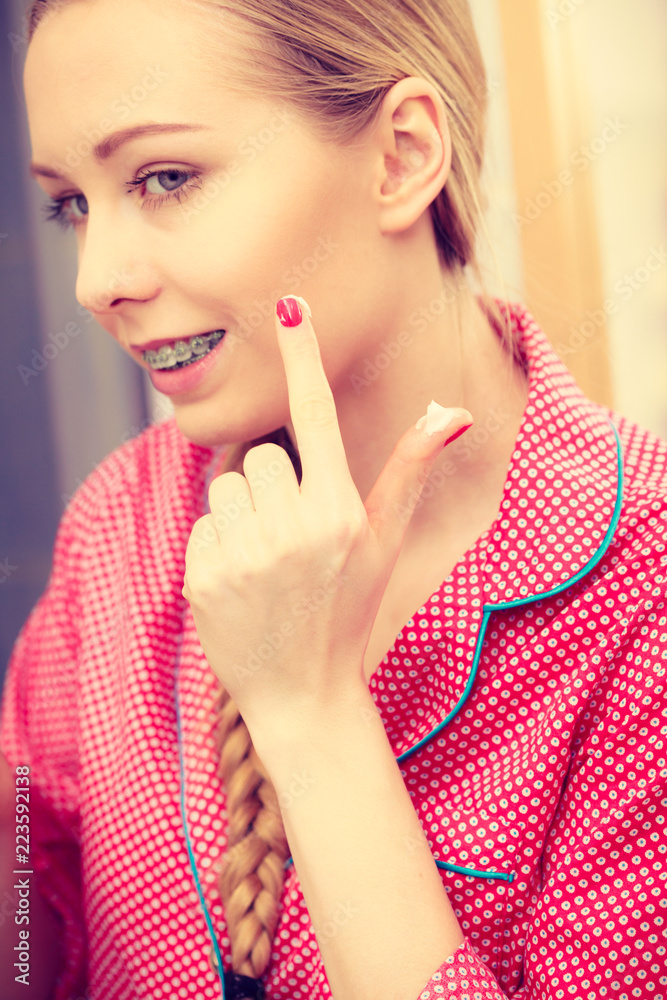 Woman applying moisturizing skin cream. Skincare. Woman applying moisturizing skin cream. Skincare.