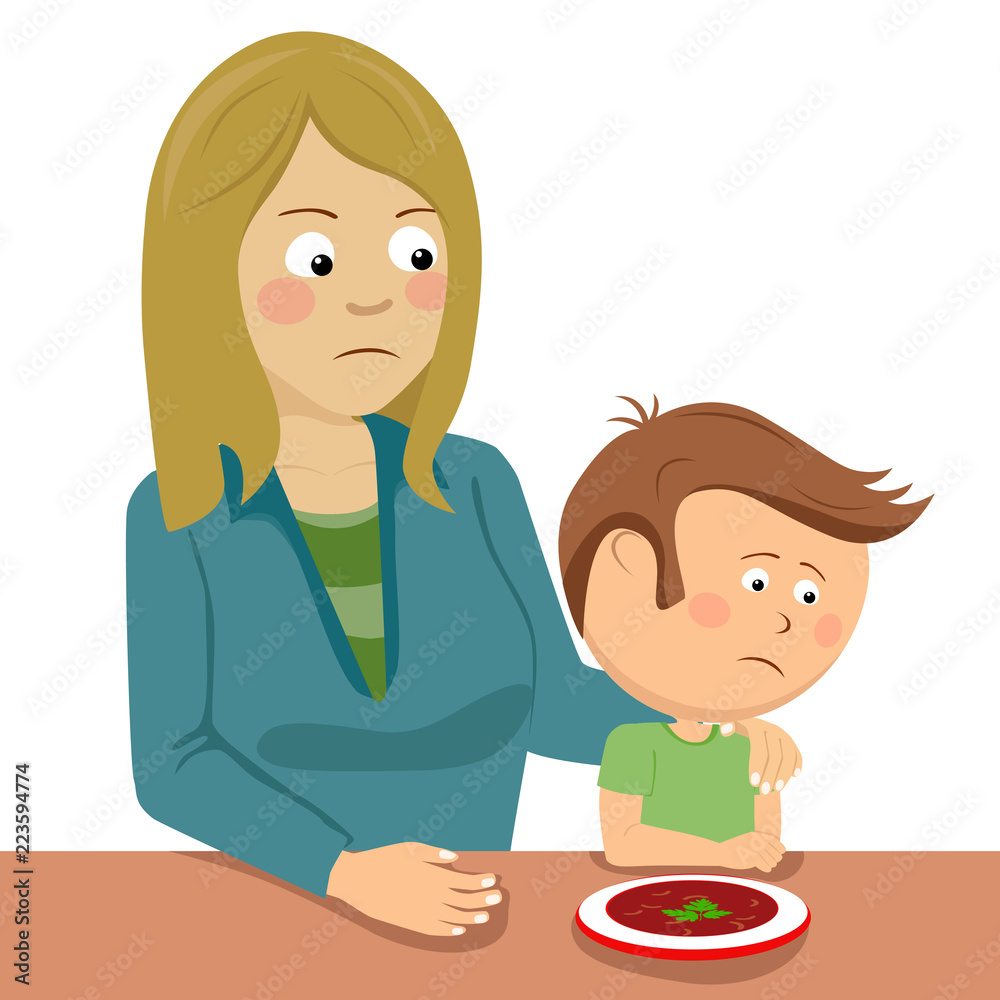 Mother consoling her little son sitting at the table Mother consoling her little son sitting at the table